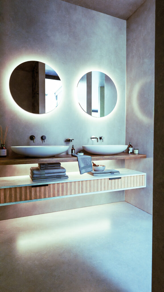 Baño moderno con lavabos sobrepuestos, espejos circulares retroiluminados y mueble de madera flotante
