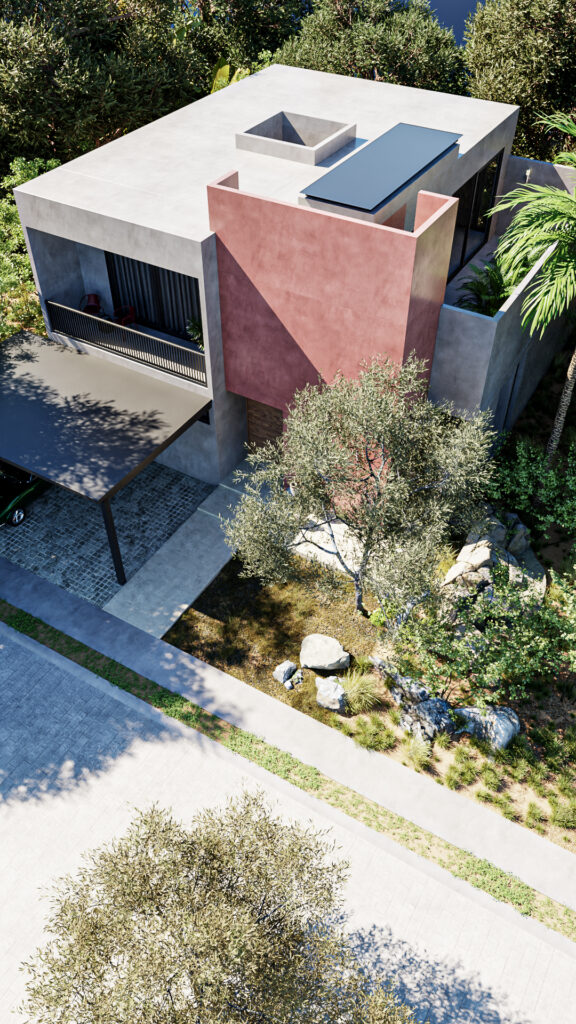 Vista aérea de la fachada de Casa OOL mostrando la volumetría de concreto y estuco pigmentado