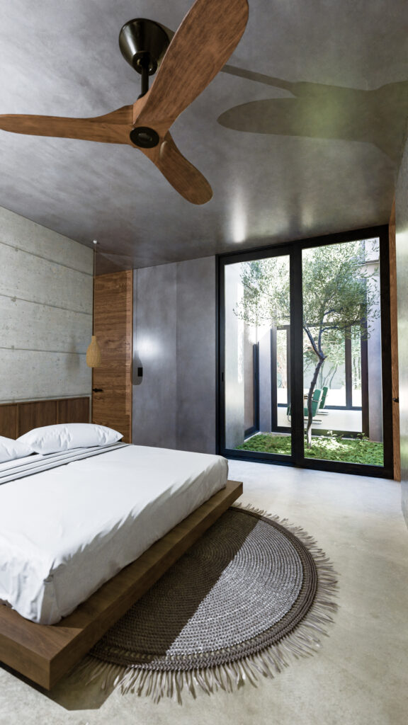 Recámara principal con techo de concreto, cama de madera y ventanal corredizo hacia patio interior con árbol