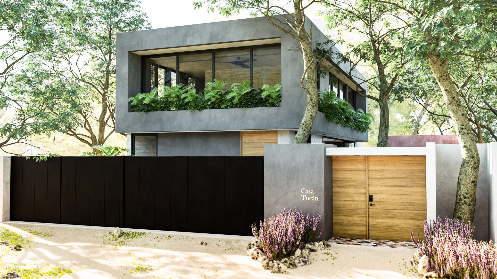 Fachada principal de Casa Tucán con volumen de concreto gris, portón negro y jardinera en planta alta
