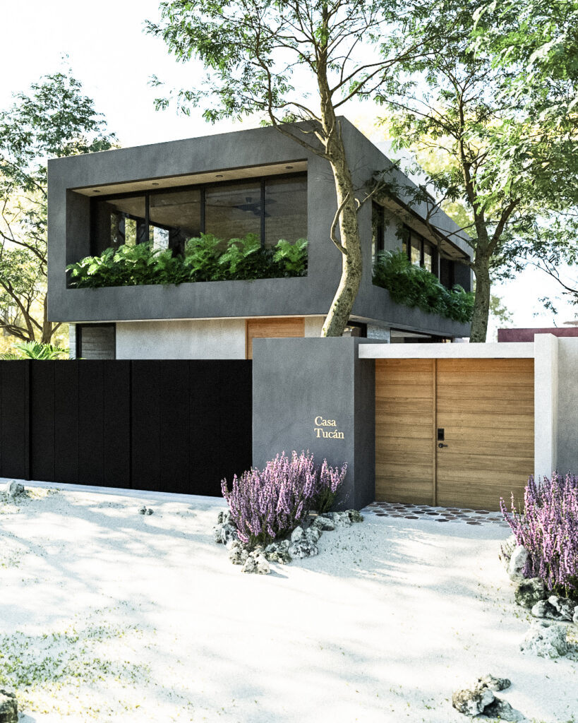 Fachada principal de Casa Tucán con volumen de concreto gris, portón negro y jardinera en planta alta