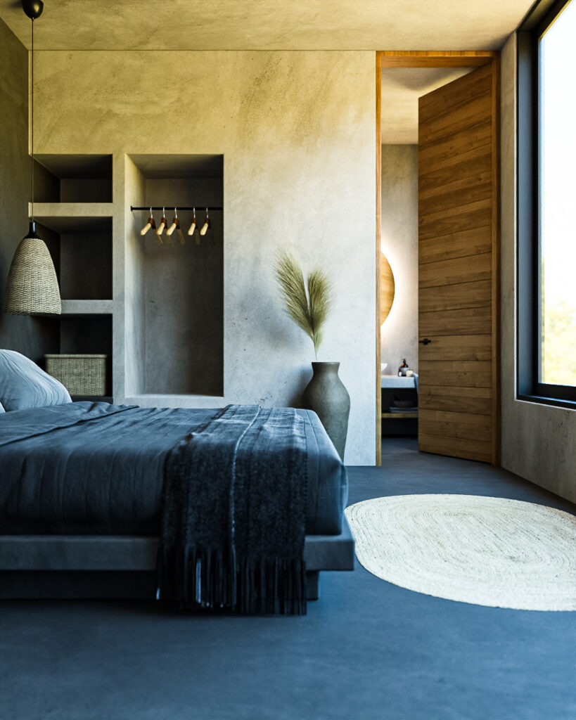 Habitación con piso de concreto oscuro, clóset de obra abierto y acceso al baño en Casa Tucán