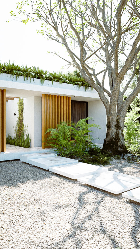 Fachada principal con listones de madera verticales, piedra Galarza y árbol monumental