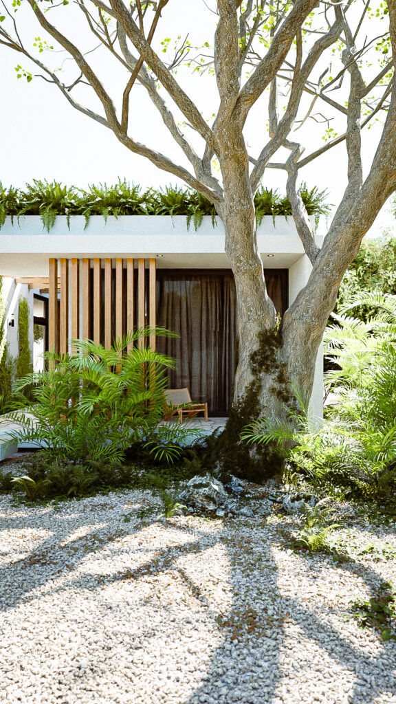 Fachada principal con listones de madera verticales, piedra Galarza y árbol monumenta