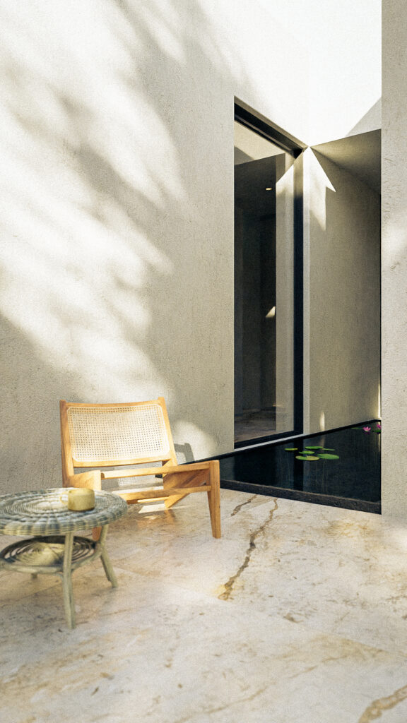 Patio interior con espejo de agua y sillas de madera tejida