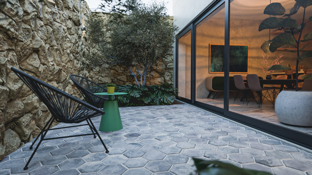 terraza de adocreto hexagonal y piedra de estilo industrial en Casa Roma