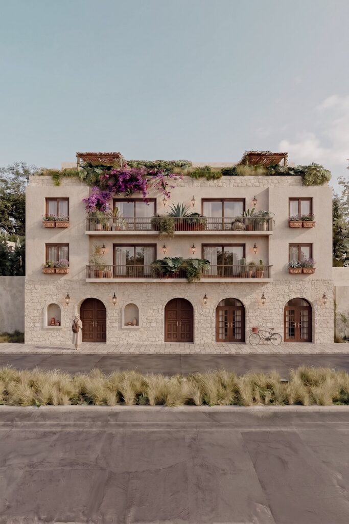 K’iin Ka’an de AERRECU: fachada de piedra con arcos, balcones y rooftop con vegetación